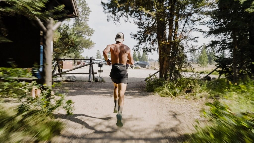 Michelino running down a forest trail