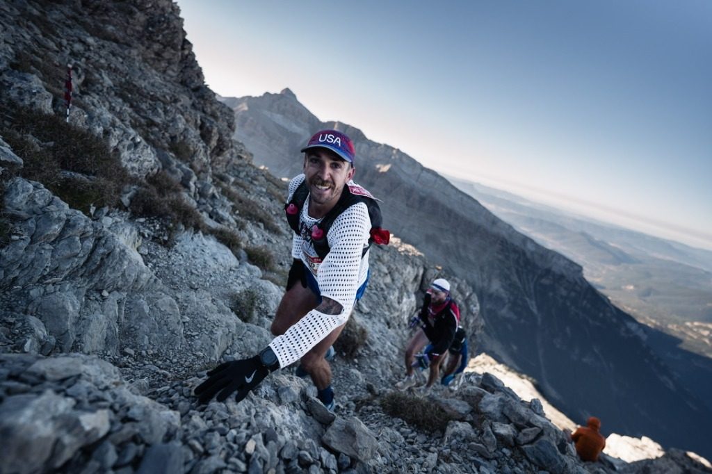 Michelino scrambling up a rocky ridge